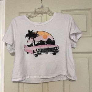 white shirt with car and sunset on the front
